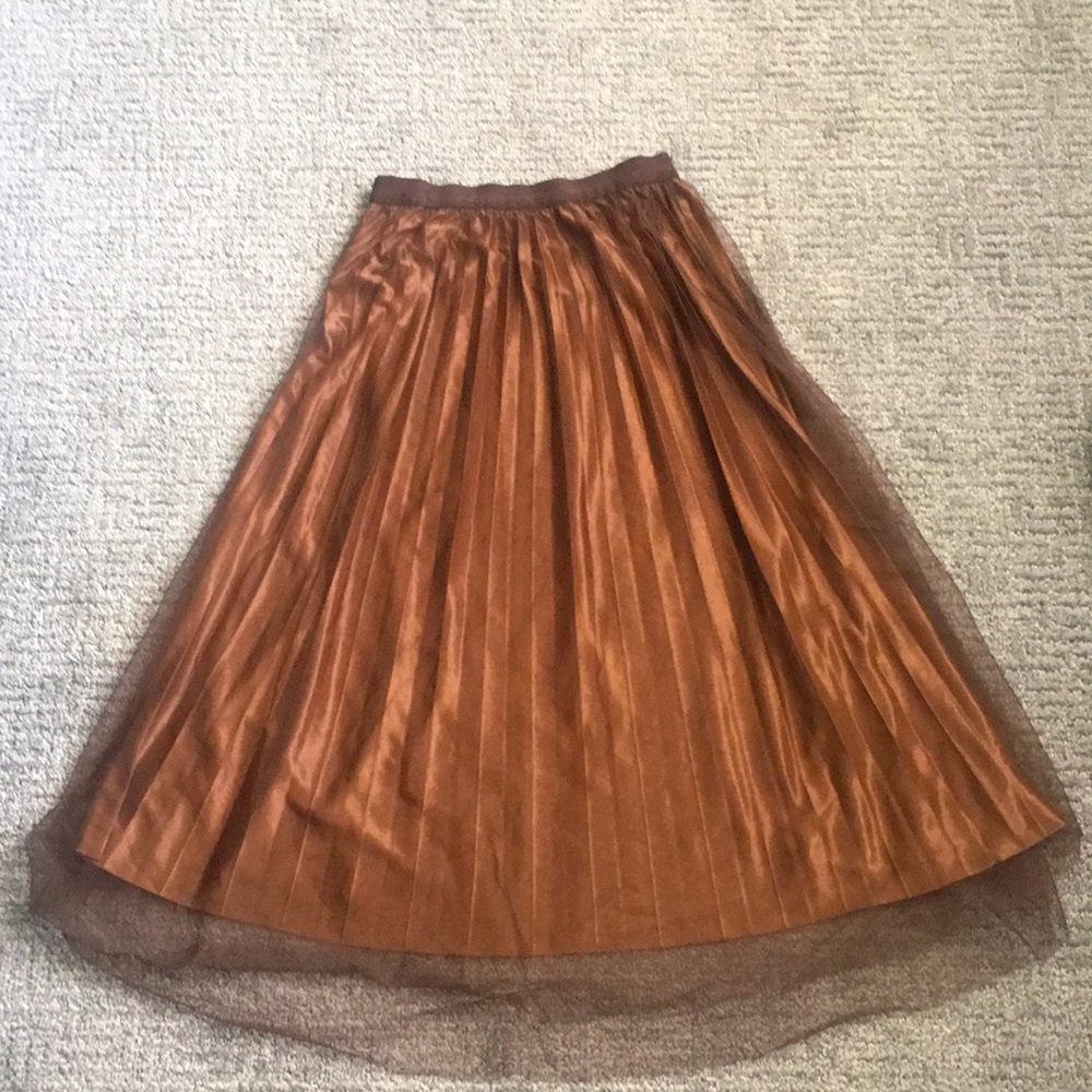 A long dark brow skirt with silk under the thread